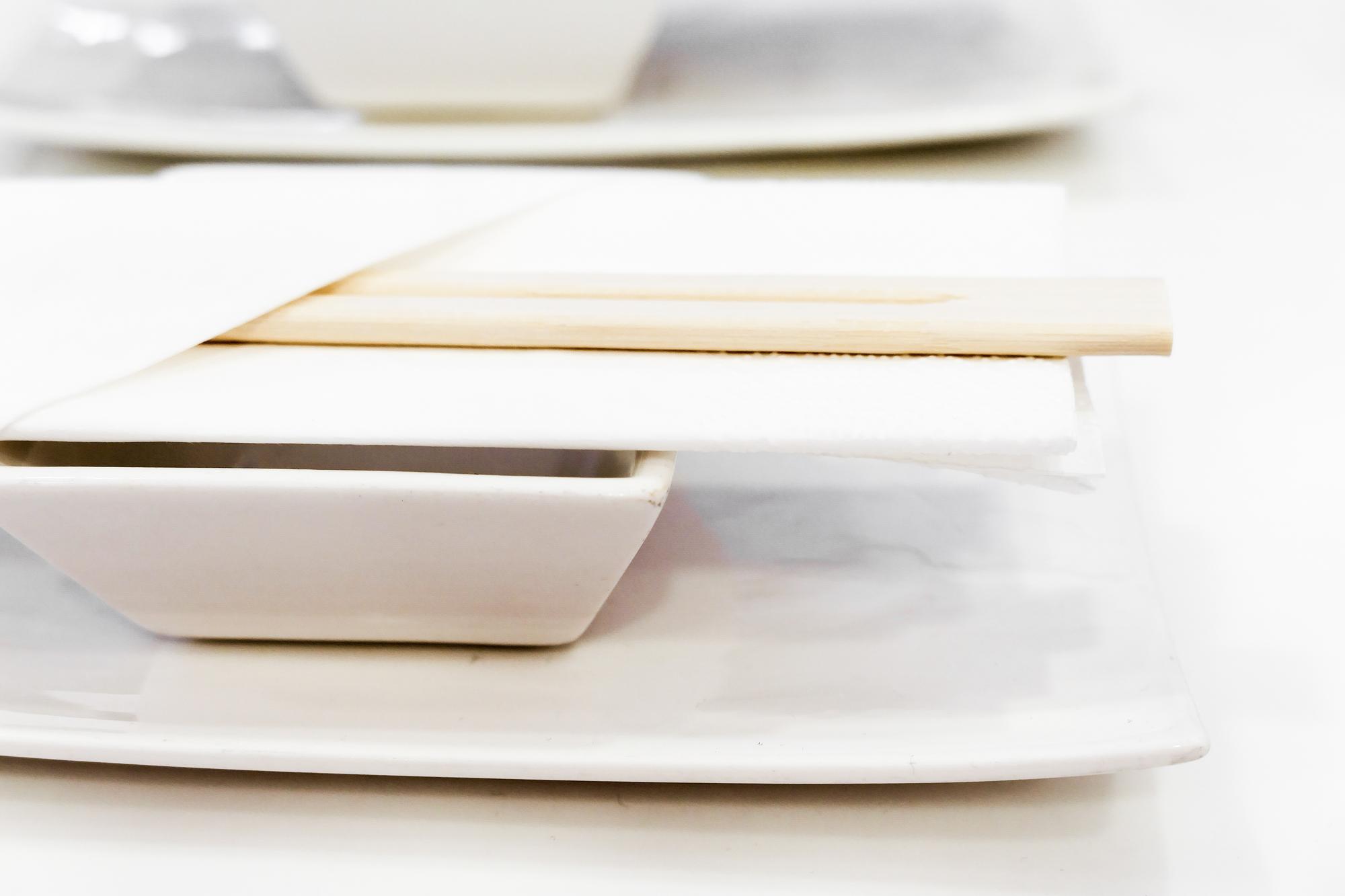 Stack of recipe books and tasting plates